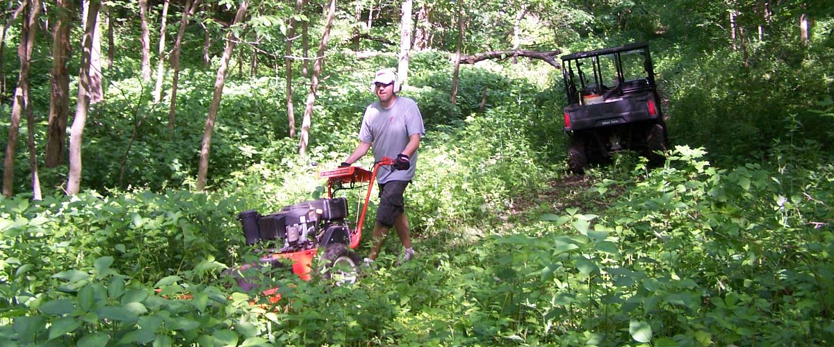 Man running rototiller on Smart Farm